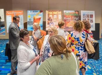 People visiting exhibit booth